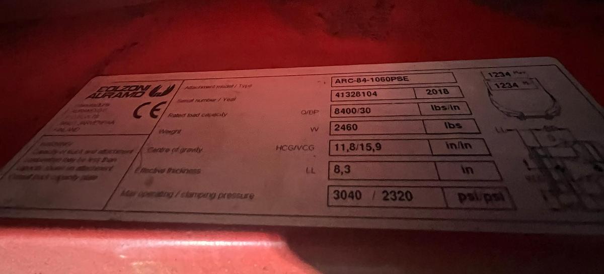 alt="Bolzoni Auramo ARC‑84‑1060PSE data plate showing model, serial number, pressure ratings, and 8,400 lb capacity"
