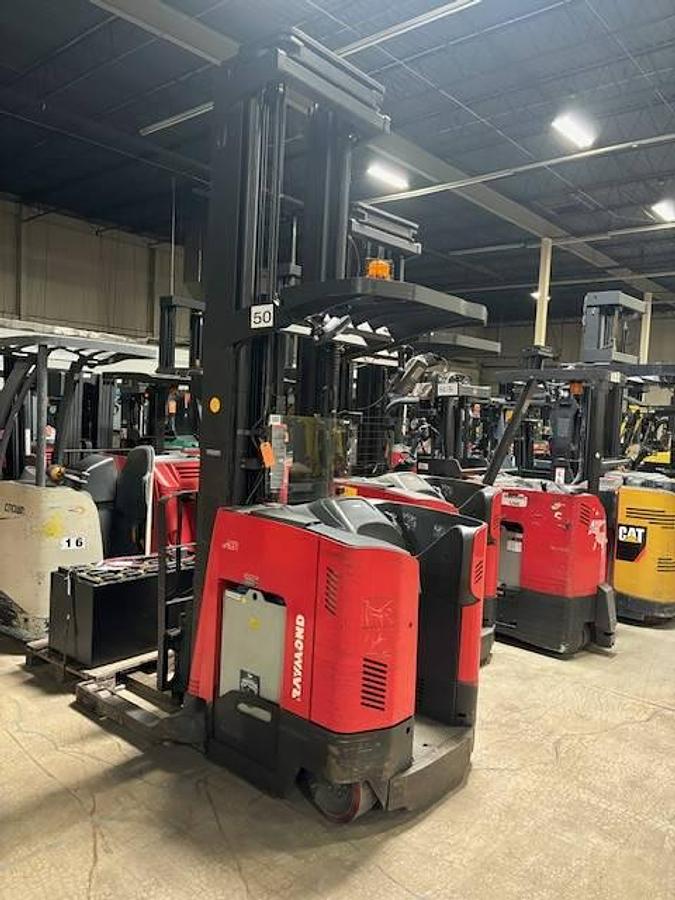 Rear side angle of Raymond 750DR32TT deep-reach forklift showing counterweight, rear wheels, and CSA certification during warehouse deployment