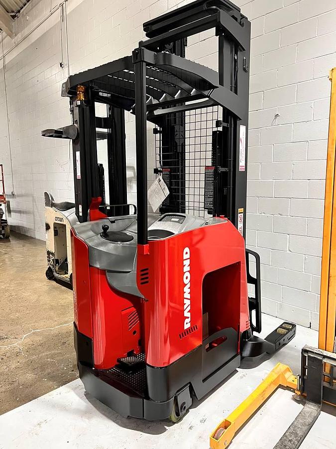 Rear angle view of Raymond 740-R45TT electric single-reach forklift with battery installed – CSA-certified 4,500 lb chassis showing counterweight, operator platform, and mast from rear perspective staged in Brampton ON – Premier Lift Equipment