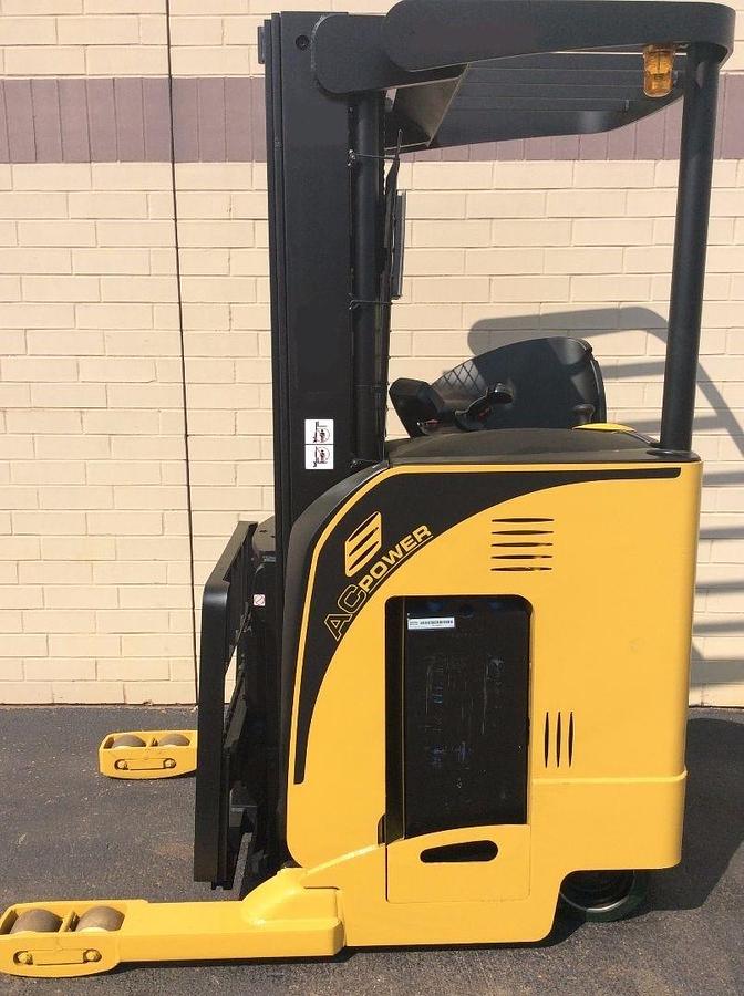 Side view of refurbished 2008 Yale NR040DANS24TE091 narrow aisle reach truck showing mast, forks, and CSA certification decal during Brampton deployment