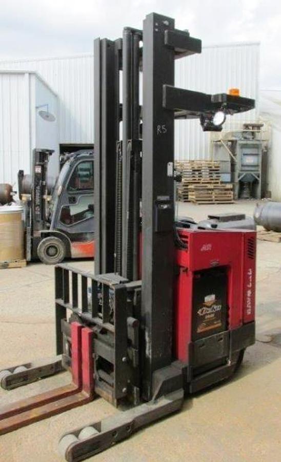 Front angle view of refurbished 2012 Raymond EASIR45TT electric reach truck showing mast, fork positioner, side shift carriage, and CSA inspection tag during Mississauga deployment