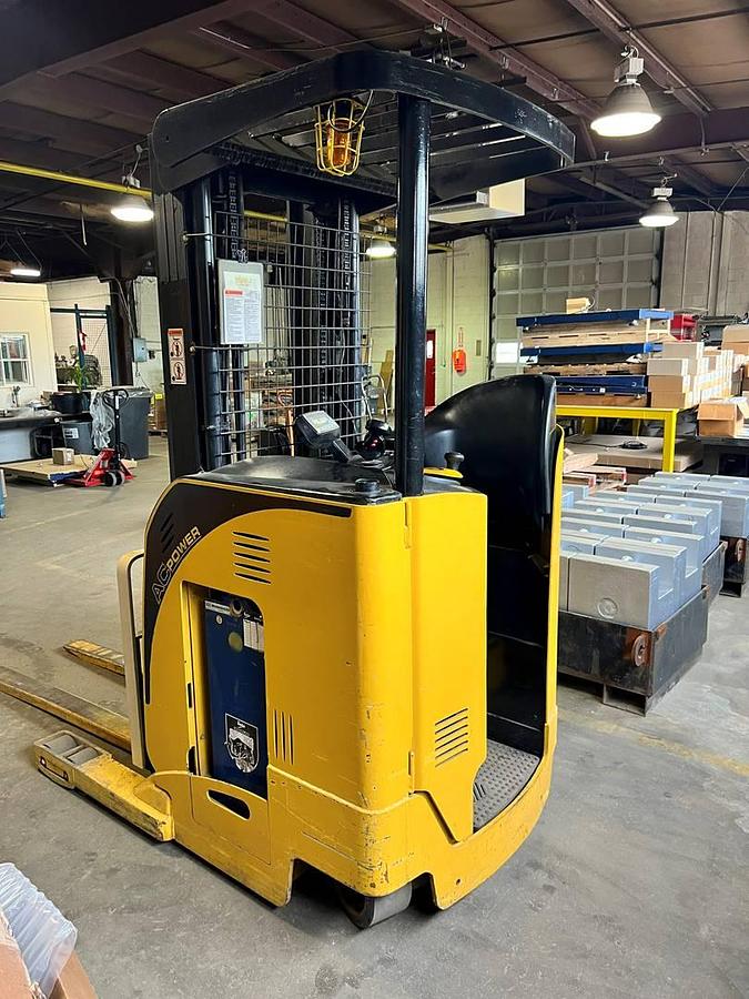 Rear angle side view of refurbished 2007 Yale NR040DANS24TE091 electric reach truck showing operator platform, counterweight, and rear chassis during Ontario deployment