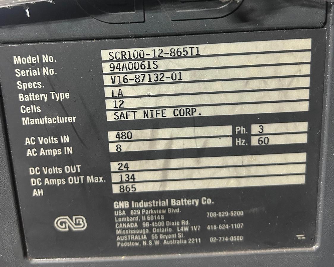 “GNB charger dataplate showing model SCR100‑12‑865T1, serial 94A00613, 24V 134A output, 12‑cell lead‑acid specs, and 480V 3‑phase input.”