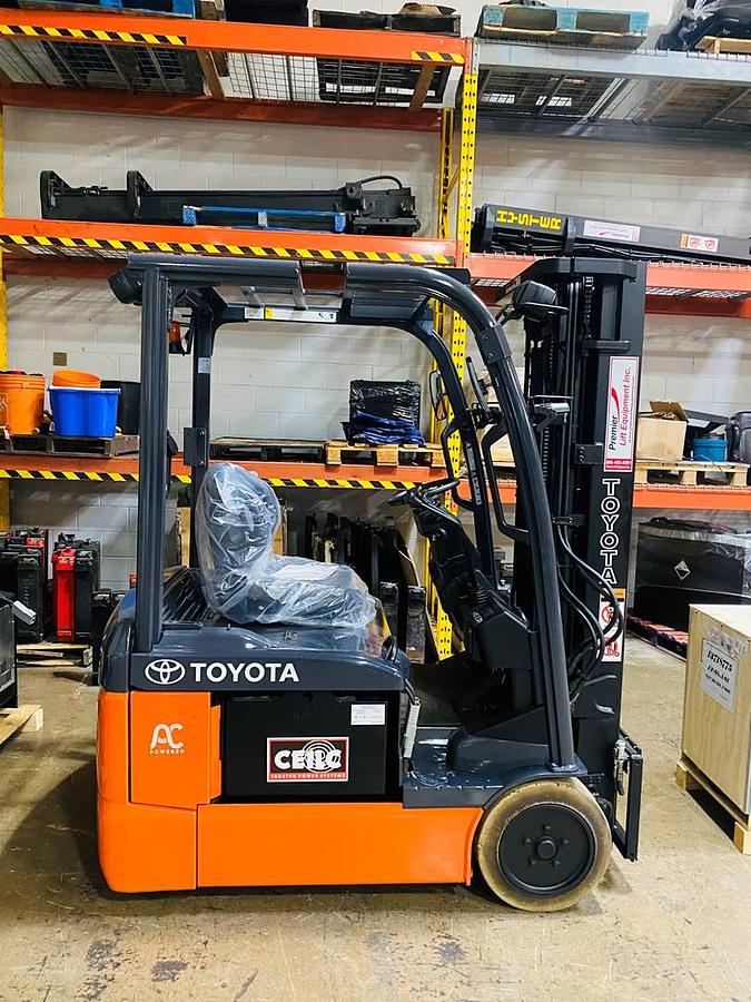 Side view of CSA-certified Toyota 8FBE15U 3-wheel electric forklift with triple mast – staged in Brampton ON