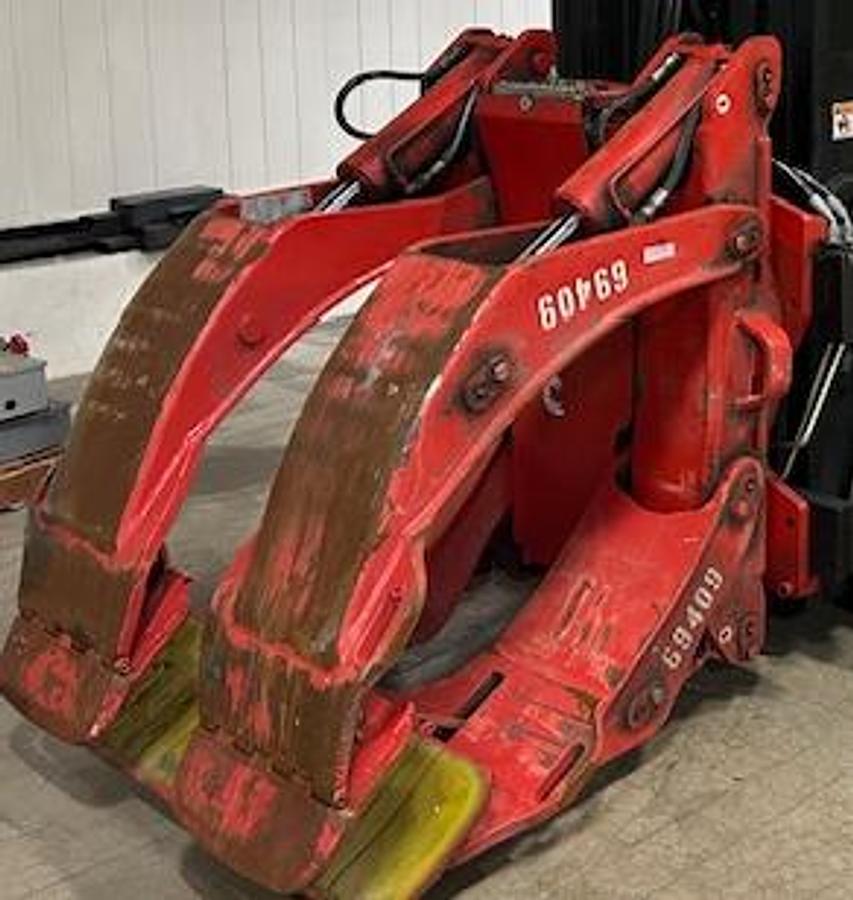 olzoni paper roll clamp forklift attachment with 180° rotation – ideal for handling large industrial rolls in packaging and printing applications