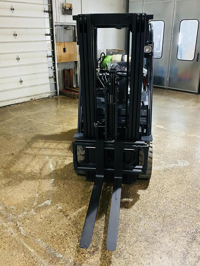 Front view of 2019 Toyota 8FGCU20 propane forklift – CSA-certified 3,400 lb chassis with 198” triple mast, 42” forks, and overhead guard shown reconditioned with safety decals applied, Brampton ON – Premier Lift Equipment