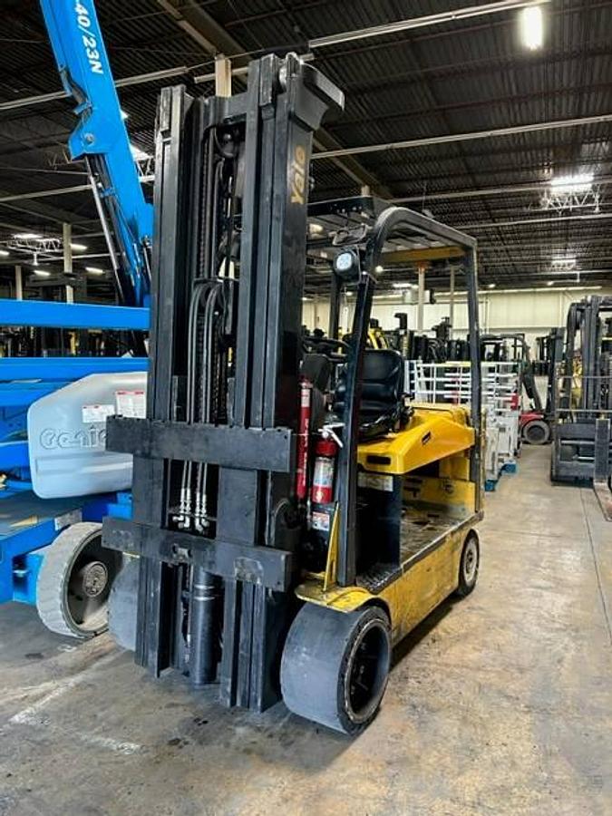Front view of refurbished 2016 Yale ERC120VHN electric forklift showing mast, carriage, and cushion tires during Brampton deployment