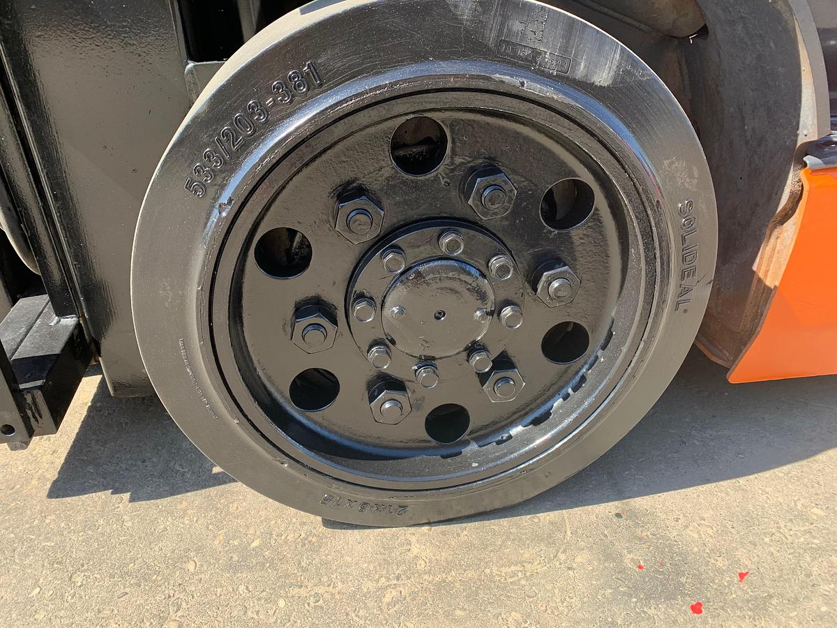 Left cushion drive tire showing wheel hub and CSA spec