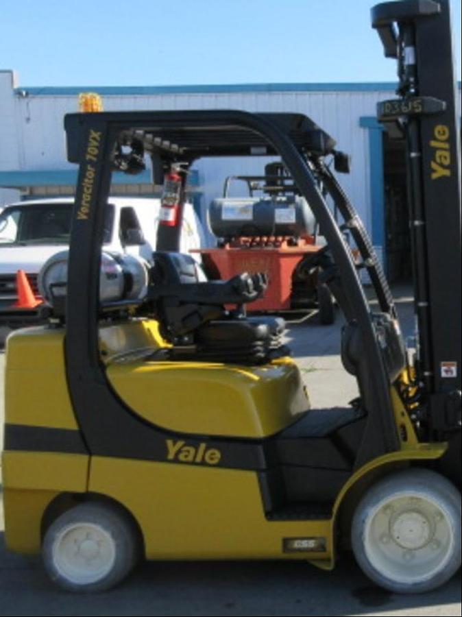 Side profile of 2013 Yale GLC070VX LPG cushion forklift showing mast rails, chassis layout, and cushion tires during Brampton deployment