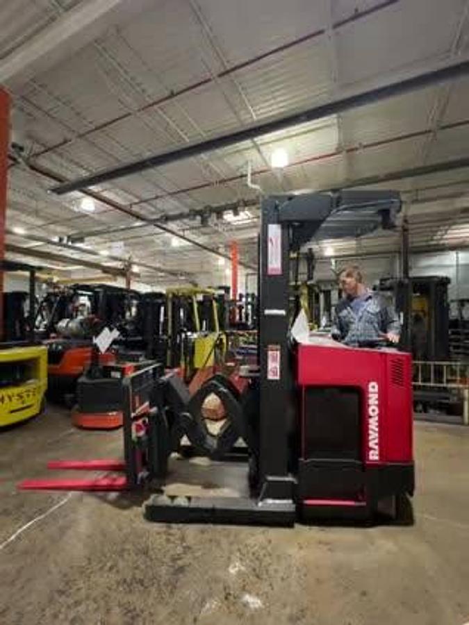 Deep reach extended view of Raymond EASIDR30TT electric double-deep reach forklift with pantograph arm fully extended – CSA-certified 3,000 lb chassis featuring 204” triple mast, 42” forks with side shift, and 36V AC power staged in Brampton ON – Premier Lift Equipment