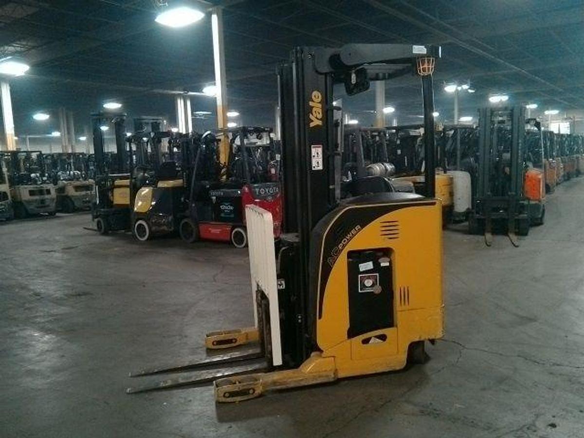 Opposite side view of refurbished 2012 Yale NR040EA electric reach truck showing 36V battery box, hydraulic lines, and CSA decal during Ontario deployment