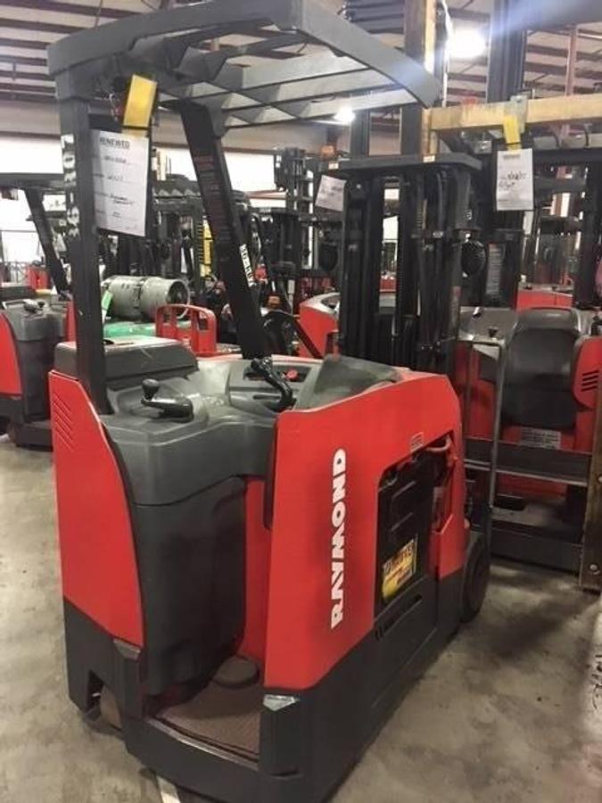 Back angled side view showing counterweight and driver compartment