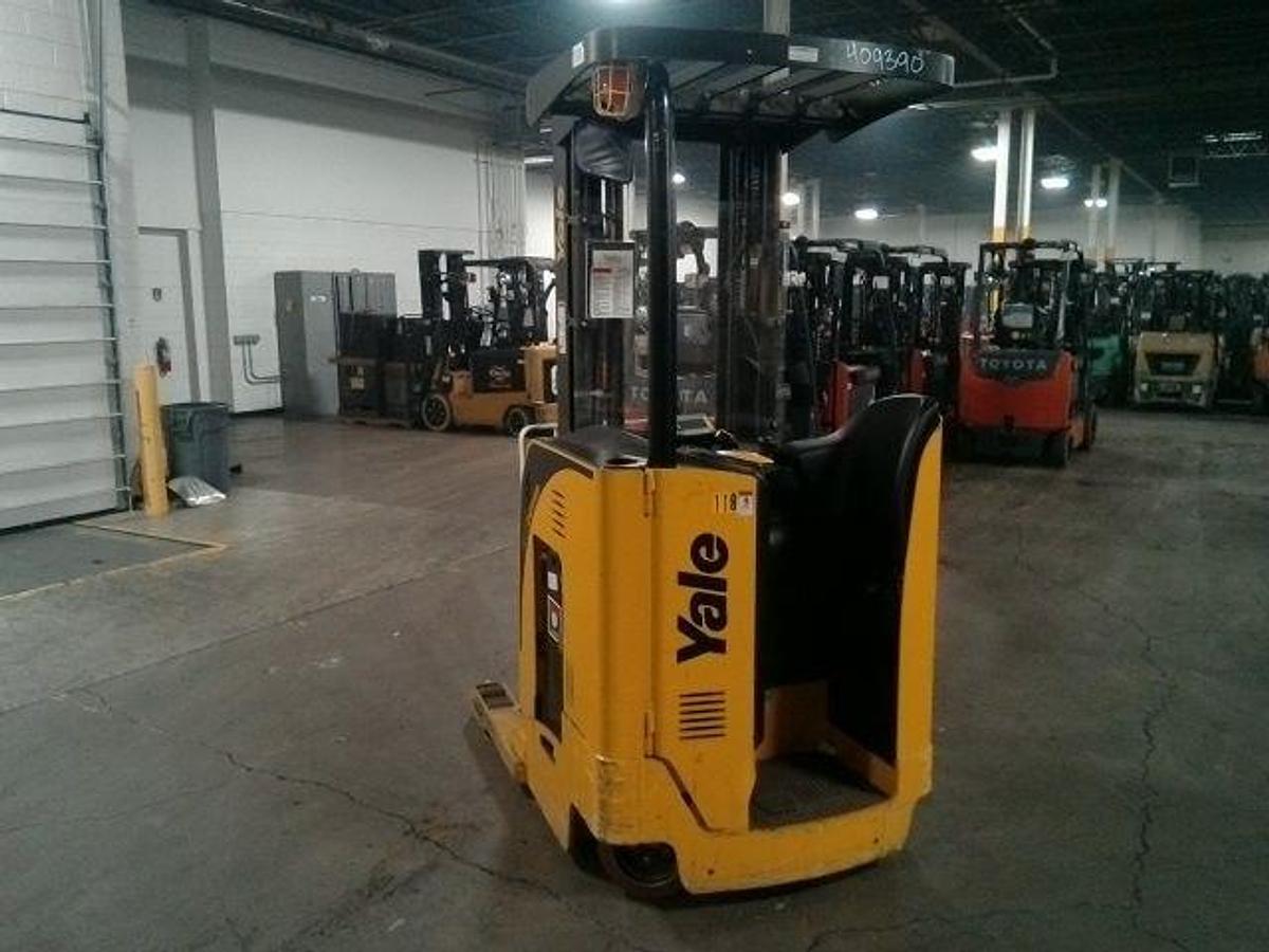 Rear angle side view of refurbished 2012 Yale NR040EA electric reach truck showing operator platform, counterweight, and rear chassis during Ontario deployment