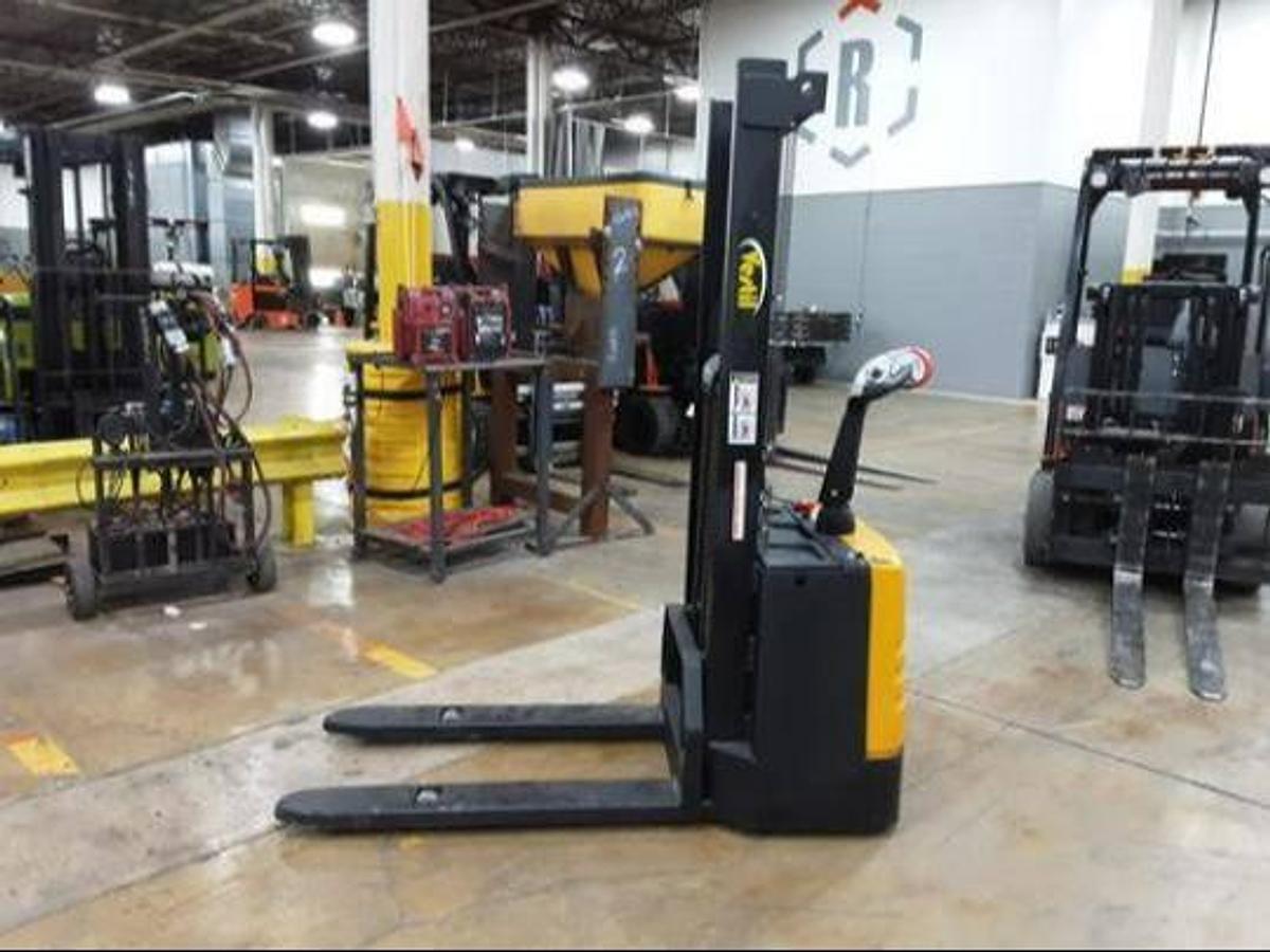 Side view of refurbished 2019 Vestil S‑62‑FF forkoover stacker showing 27"x 42" forks, 30" wide frame, 66" back‑to‑tip reach, 62" lift height, 2‑stage mast, and CSA certification decal during Brampton deployment.