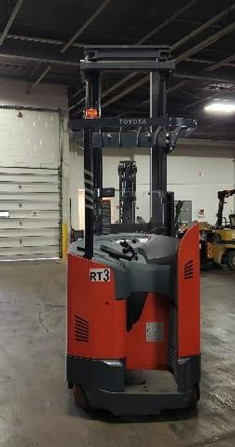 Back view of Toyota 9BRU23 single reach electric forklift shown chassis only with optional new or used battery available – CSA-certified 4,500 lb unit featuring 280” triple mast, rear operator entry with overhead guard, 36V AC chassis, and compact counterweight staged in Brampton ON – Premier Lift Equipment