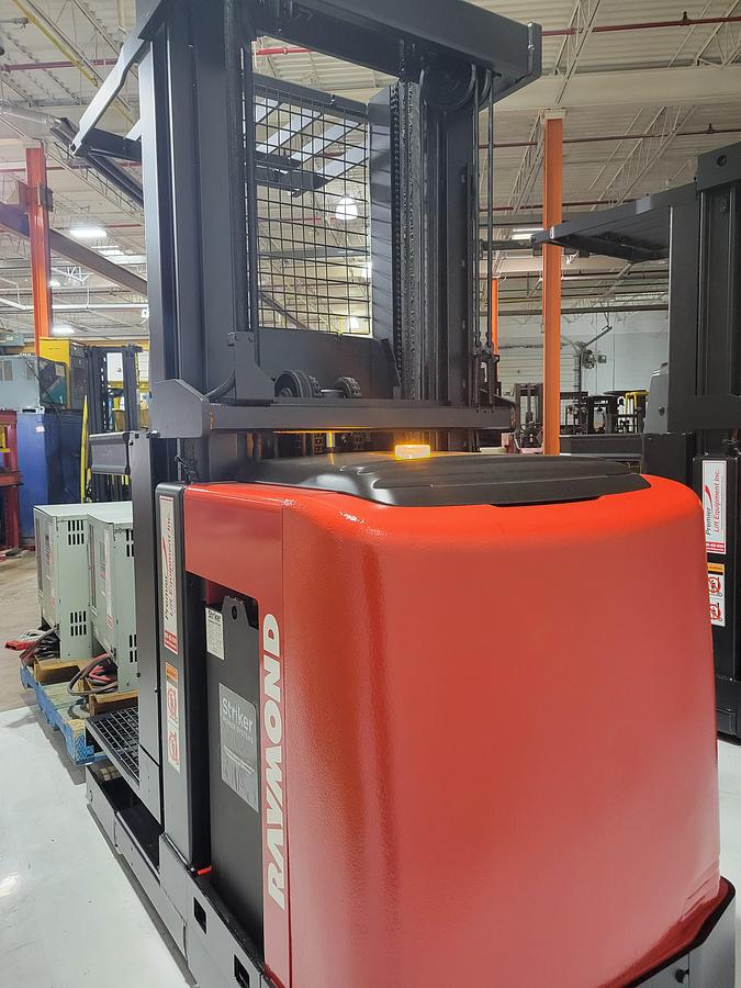 Rear view of refurbished 2006 Raymond 520-OPC30TT electric order picker showing counterweight, battery door, and rear chassis panel during Mississauga deployment