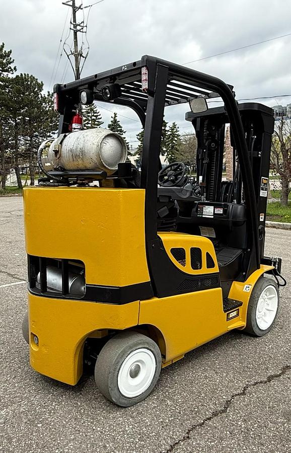 Opposite side view showing LPG tank mount and CSA-certified labeling