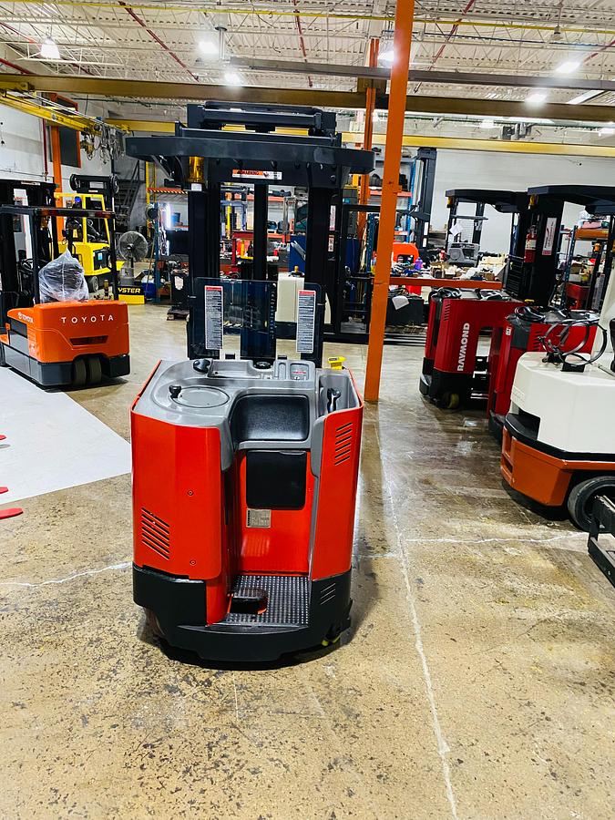 Rear view of refurbished 2013 Raymond EASIR30TT reach truck showing reach mast, battery compartment, and CSA decals during Mississauga deployment