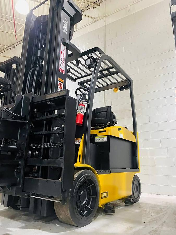 Front side view of refurbished 2014 Yale ERC080VHN48 electric cushion tire forklift showing superior swing mast attachment, 48" forks, CSA certification decal, and operator compartment during Los Angeles deployment.