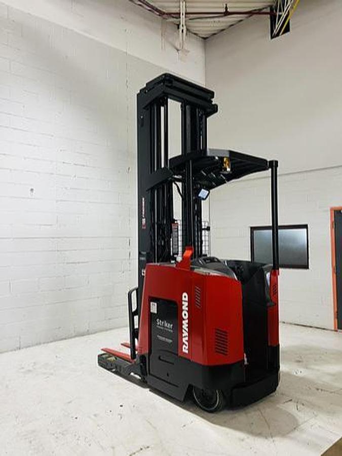 Rear side view showing counterweight and mounted safety lighting