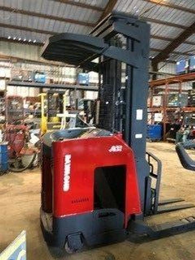 Opposite side profile of refurbished 2008 Raymond 740DR32TT electric deep-reach forklift showing 240" triple mast, reach carriage, and narrow aisle chassis during Brampton deployment