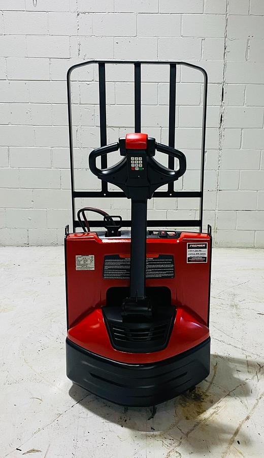 Rear chassis view of 2020 Raymond 8210 walkie pallet jack, showing motor housing and drive wheel.