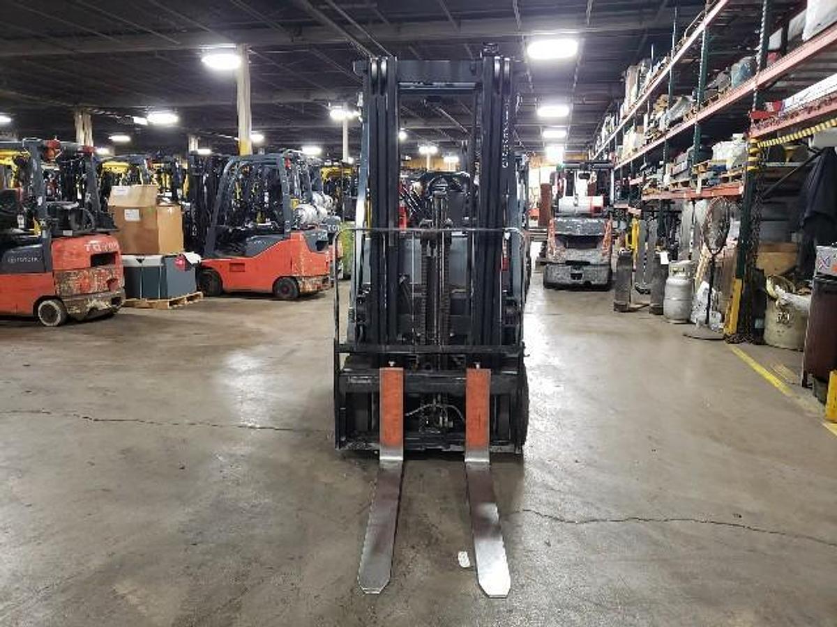 2020 Toyota 8FBCU20 electric forklift front view showing mast and carriage"