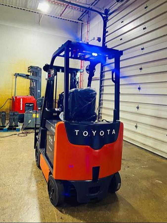 Rear view of 2016 Toyota 8FBCU20-COMP electric forklift – CSA-ready 4,000 lb compact chassis with rear counterweight, overhead guard, and cushion tires shown reconditioned with new 36V battery upgrade option available in Brampton ON – Premier Lift Equipment