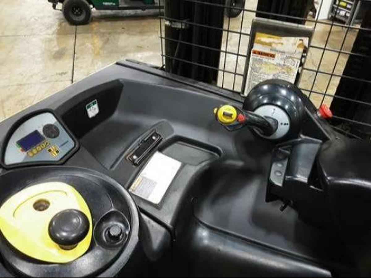 Operator compartment of refurbished 2018 Hyster N35ZR2 electric reach truck showing stand‑up operator area, steering controls, hydraulic levers, battery indicator, and CSA certification decal during Ontario deployment.