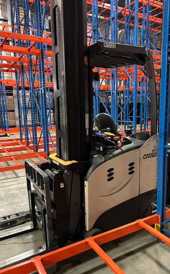 Side Angle view of CSA-certified Crown RMD6095S electric deep reach truck with pantograph arm – staged in Brampton ON