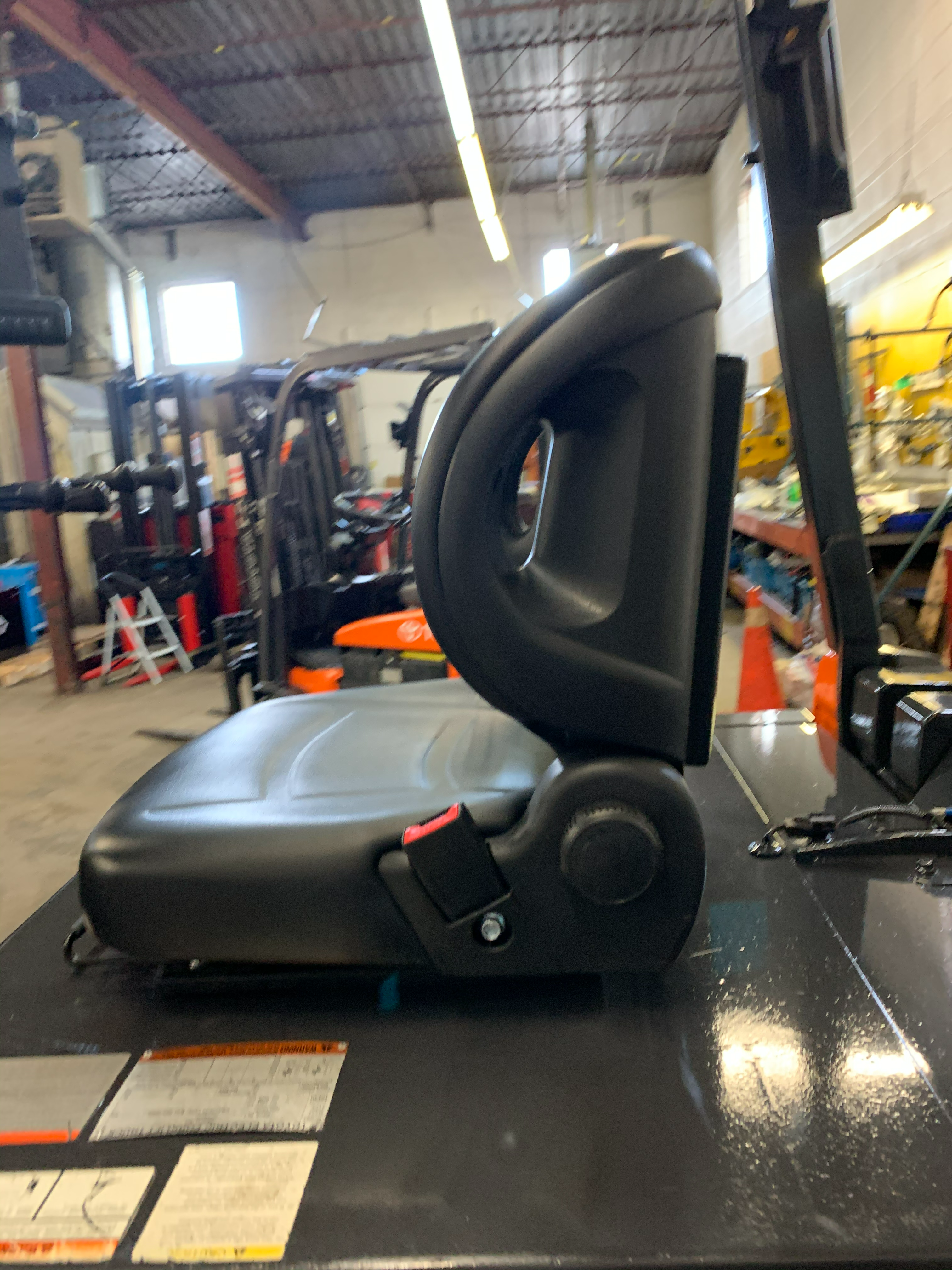 Toyota 8FBCU32 electric forklift — operator seat and controls
