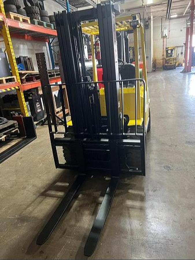 Front view showing forks and mast on Budget H50XM forklift.
