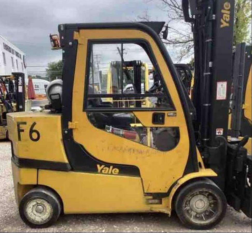 Side profile of 2020 Yale GC120SVX LPG cushion forklift showing mast rails, cab enclosure, and chassis layout during Brampton deployment
