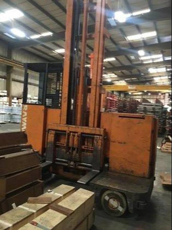 Front Side Angle View – Pre-Refurbish Vintage 1981 Raymond 76-SL100TF electric sideloader with 240" lift shown in unrestored condition during Brampton intake