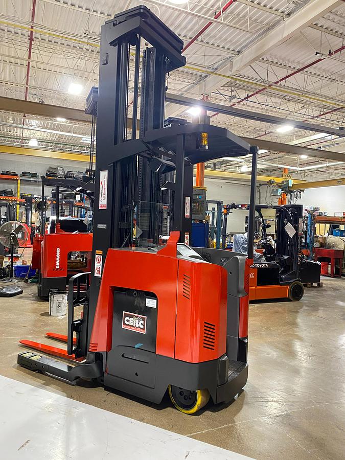 Opposite side view of 2022 Raymond 752-DR32TT deep reach forklift showing triple-stage mast, cold storage conditioning package, battery compartment, and CSA-certified chassis – unit staged in Brampton ON