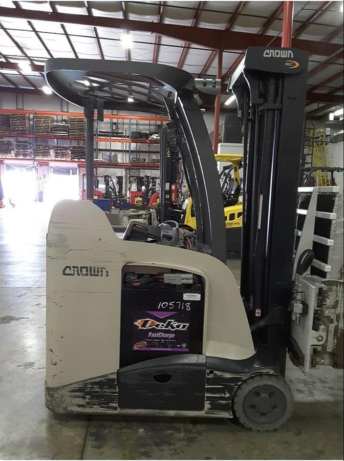 Side view of refurbished 2013 Crown RC5545‑40 electric forklift showing chassis, 4‑way hydraulics, 36 volt battery compartment, and CSA certification decal during Ontario deployment.