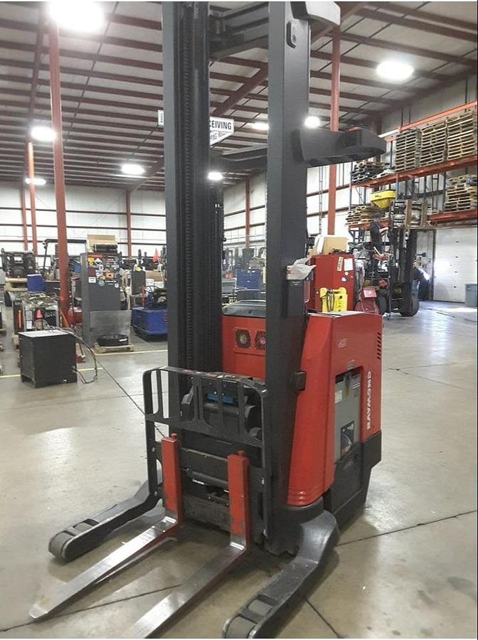 Front angle view of refurbished 2013 Raymond 750R45TT electric reach truck showing mast, forks, side shift carriage, and CSA inspection tag during Vaughan deployment