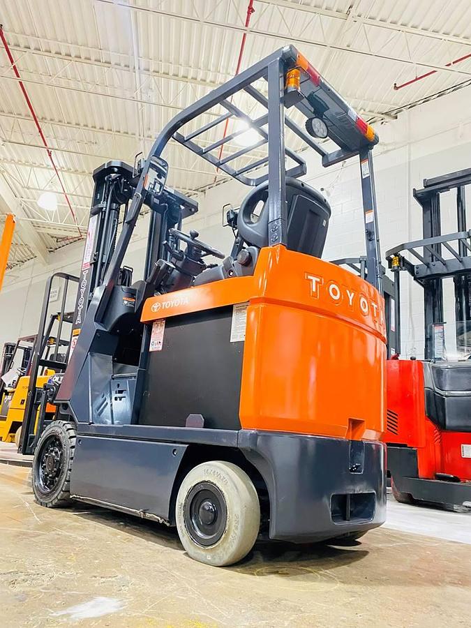 Toyota 7FBCU15 – reverse rear angle – steering column, rear tires, and safety decals – CSA/MOL certified 4-wheel electric forklift – Brampton ON