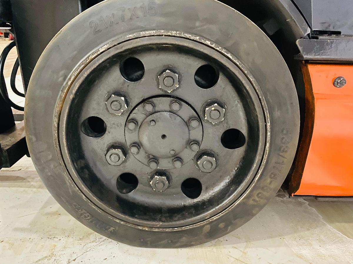 Left cushion drive tire showing wheel hub and CSA spec