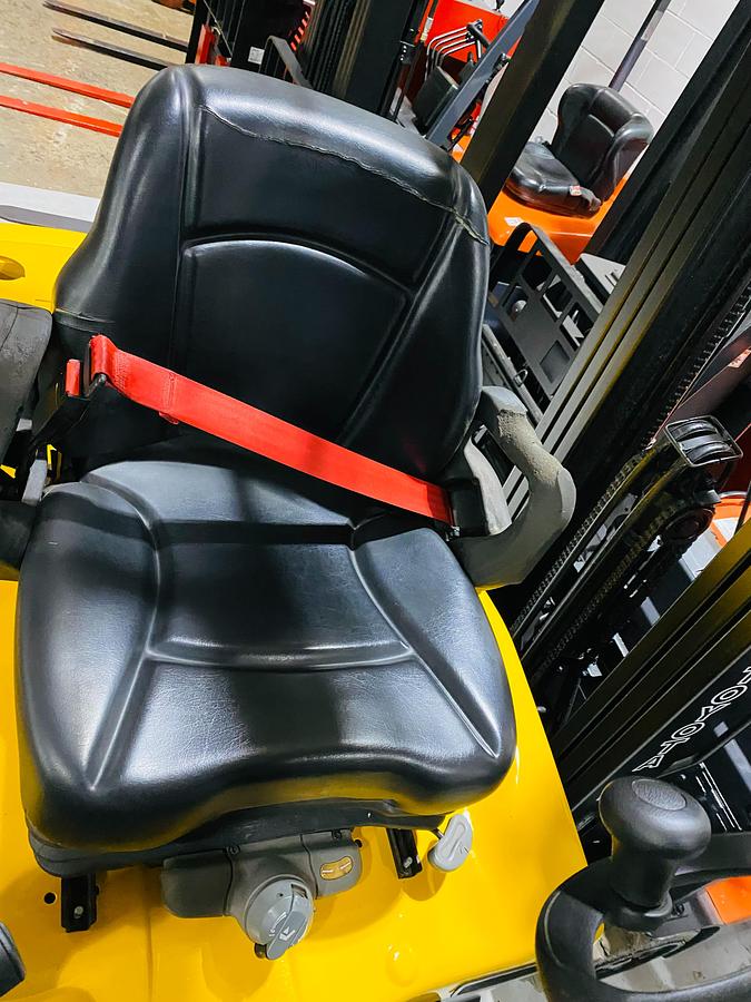 Operator seat and seat belt of Yale ERC065VG turret lift truck showing padded seat, hip restraints, and CSA-certified operator compartment – unit staged in Brampton ON