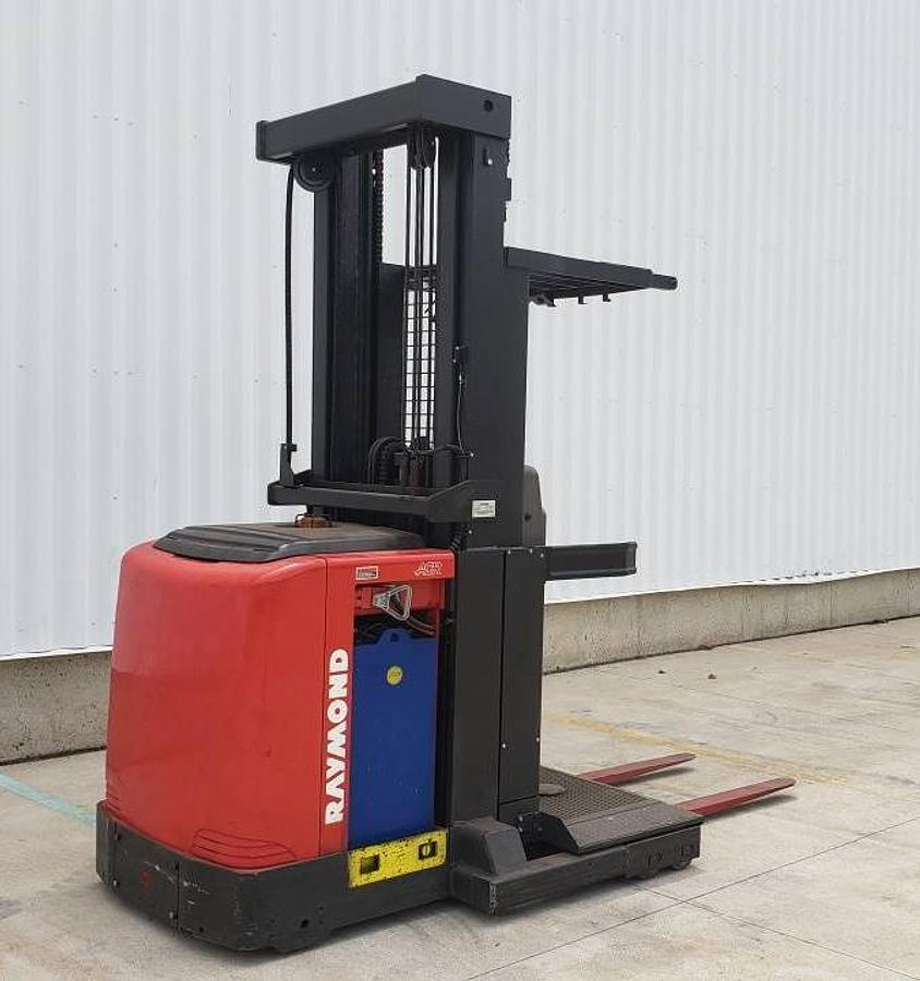 Opposite side view of refurbished 2013 Raymond 550-OPC30TT electric order picker showing battery enclosure, drive unit cover, and chassis structure during Mississauga deployment