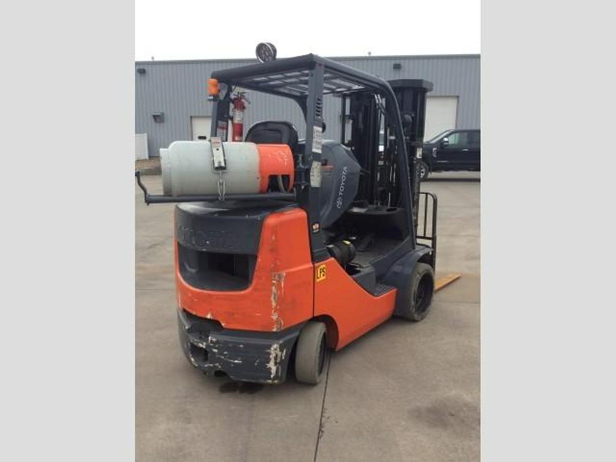 Opposite rear side angle of refurbished Toyota LP gas forklift showing rear chassis and propane tank mount during Brampton deployment