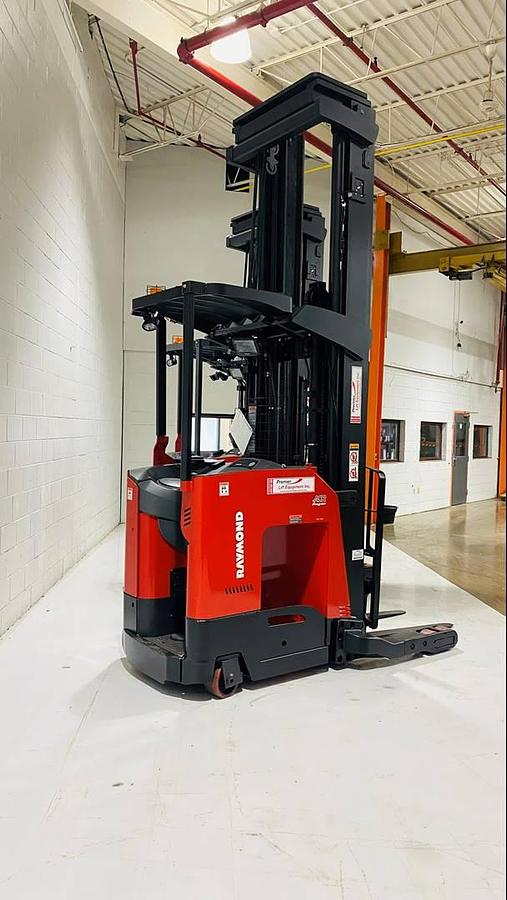 Side view of 2022 Raymond 752-R45TT freezer-rated reach truck – CSA-certified 4,500 lb chassis-only unit with 348” triple mast, 42” forks, and 41” baseleg opening shown brand new and staged without battery or charger in Brampton ON – Premier Lift Equipment