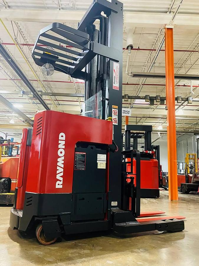 Refurbished 2013 Raymond EZ-R30TT electric reach truck with CSA certification and new paint deployed in Mississauga for narrow aisle warehouse operations
