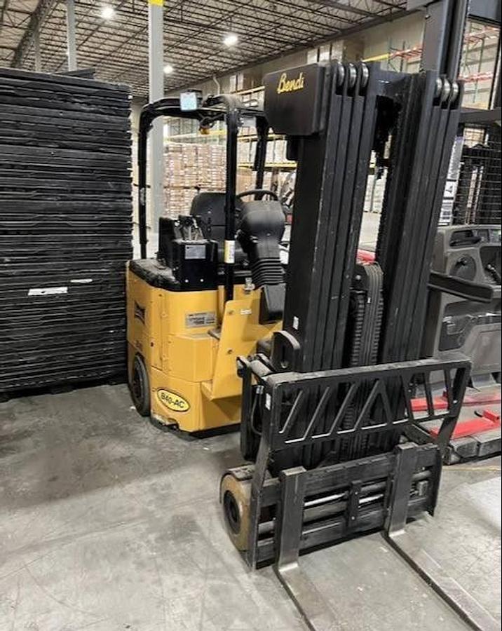 Opposite front side view of refurbished 2016 Bendi B40AC SwingMast forklift showing 42" forks, solid cushion tires, 48 volt chassis, 258" quad mast, and CSA certification decal during Brampton deployment.