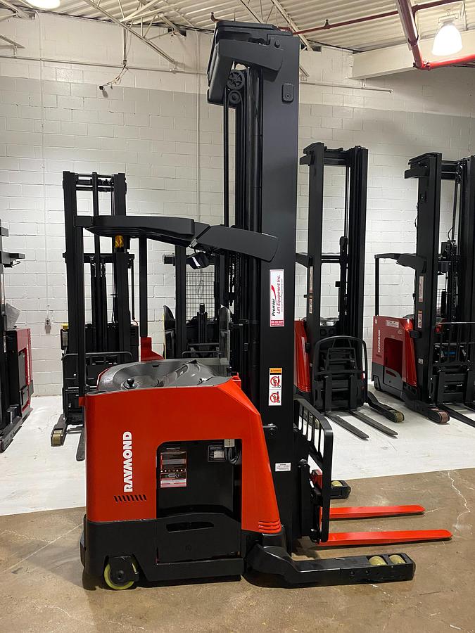 Side view of 2022 Raymond 752-DR32TT deep reach forklift showing triple-stage mast, cold storage conditioning package, poly tires, and CSA-certified chassis – unit staged in GTA ON