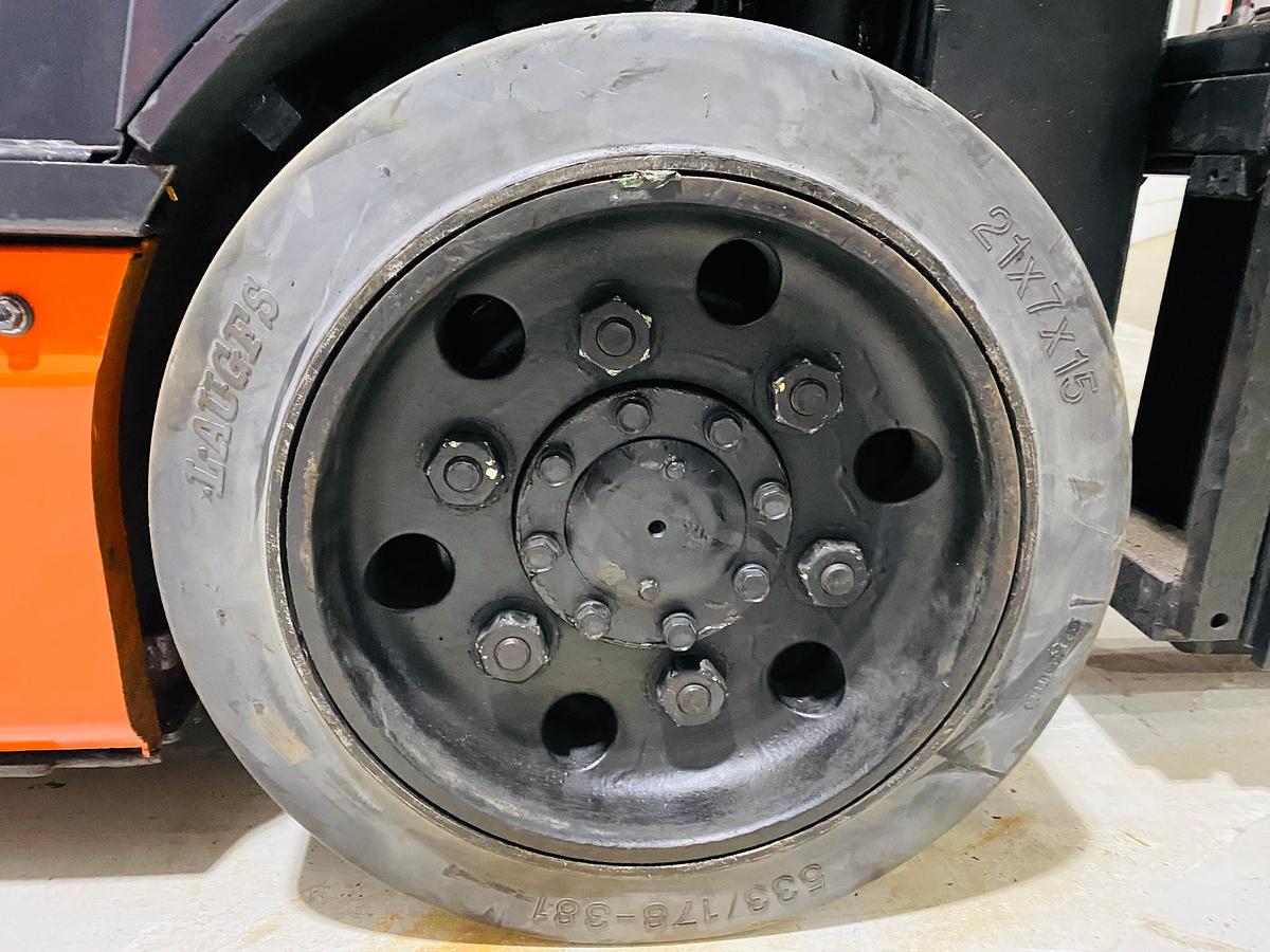 Right cushion drive tire showing smooth tread pattern and CSA indoor spec