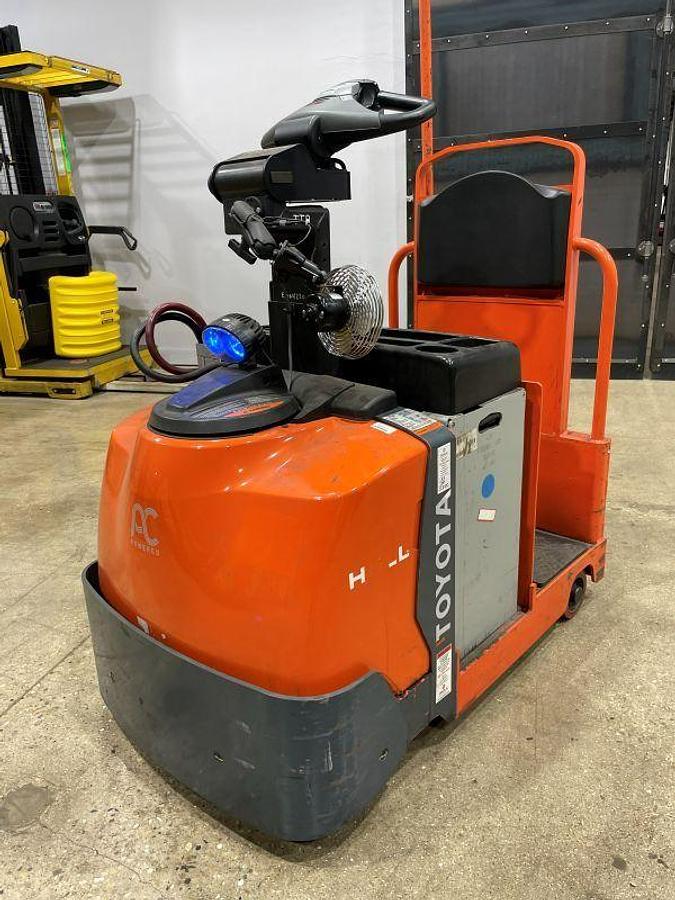 Refurbished 2021 Toyota 8BT50 stand-up electric tow tractor with 710 lb drawbar pull and 24V power system
