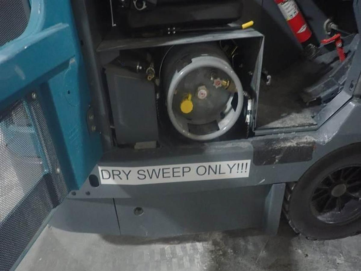 "2023 Tennant S30 LP rider sweeper propane tank compartment view"