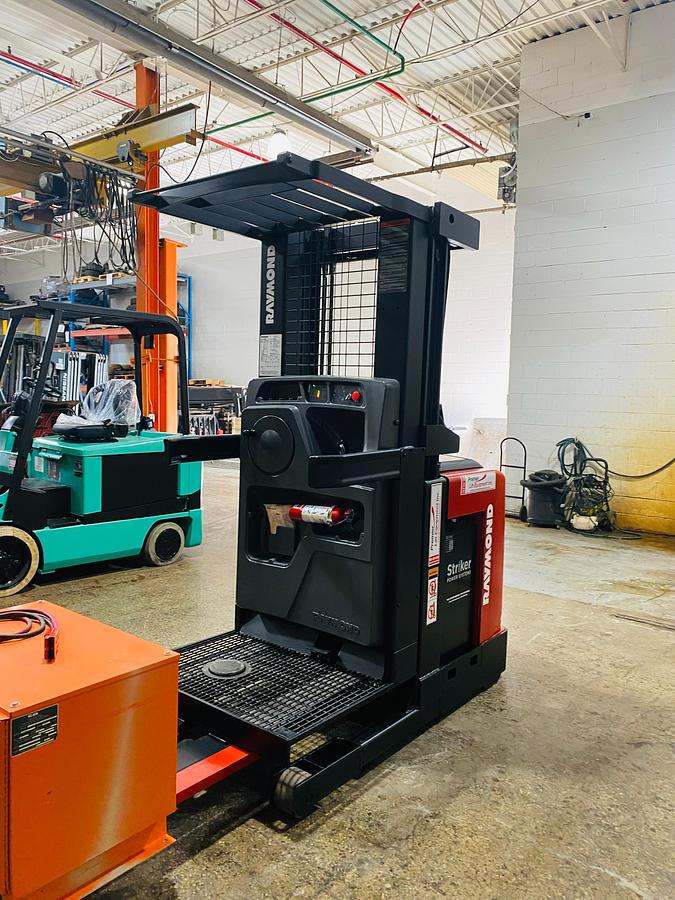 Raymond 550-OPC30TT WG – angled front view – picker platform and triple mast – CSA/MOL certified electric order picker – Brampton ON